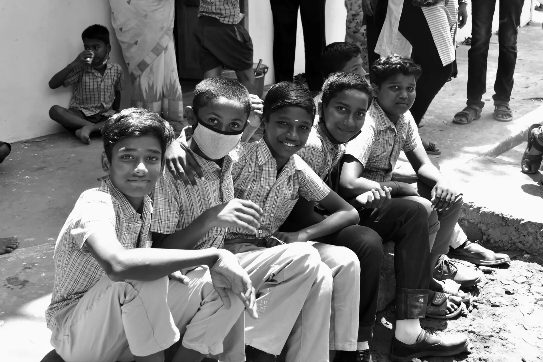 Smiling school boys in Tamil Nadu supported by V V Charitable Trust's education and welfare programs for underprivileged children.